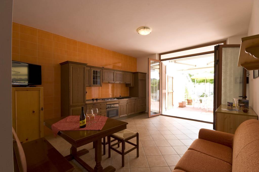 Amarenumana Aparthotel Habitación foto