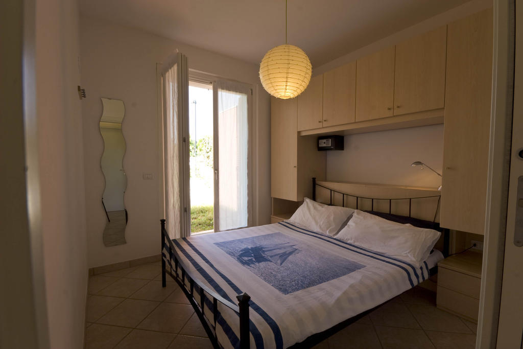 Amarenumana Aparthotel Habitación foto